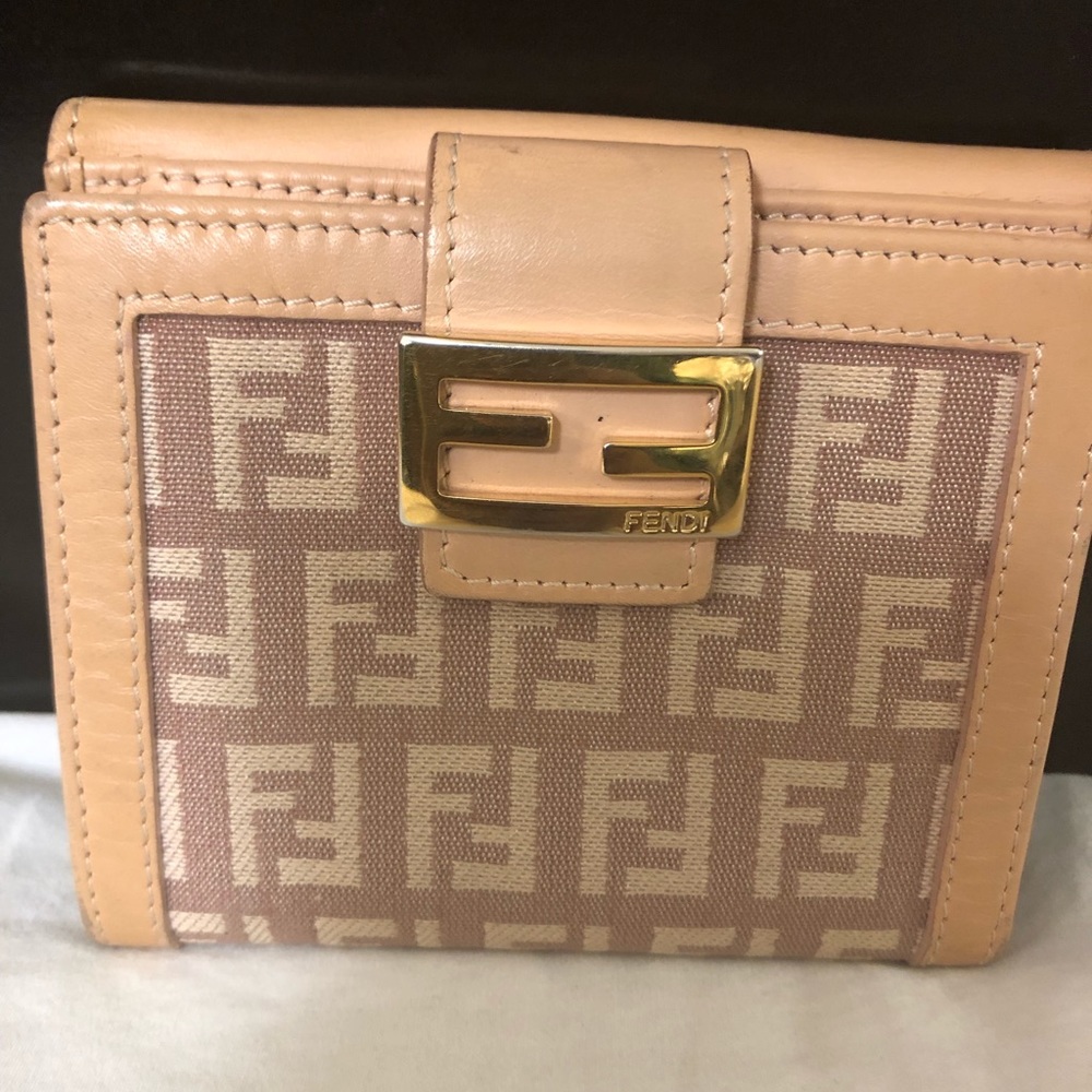 Authentic Fendi baguette bifold small wallet  monogram leather tan salmon color.